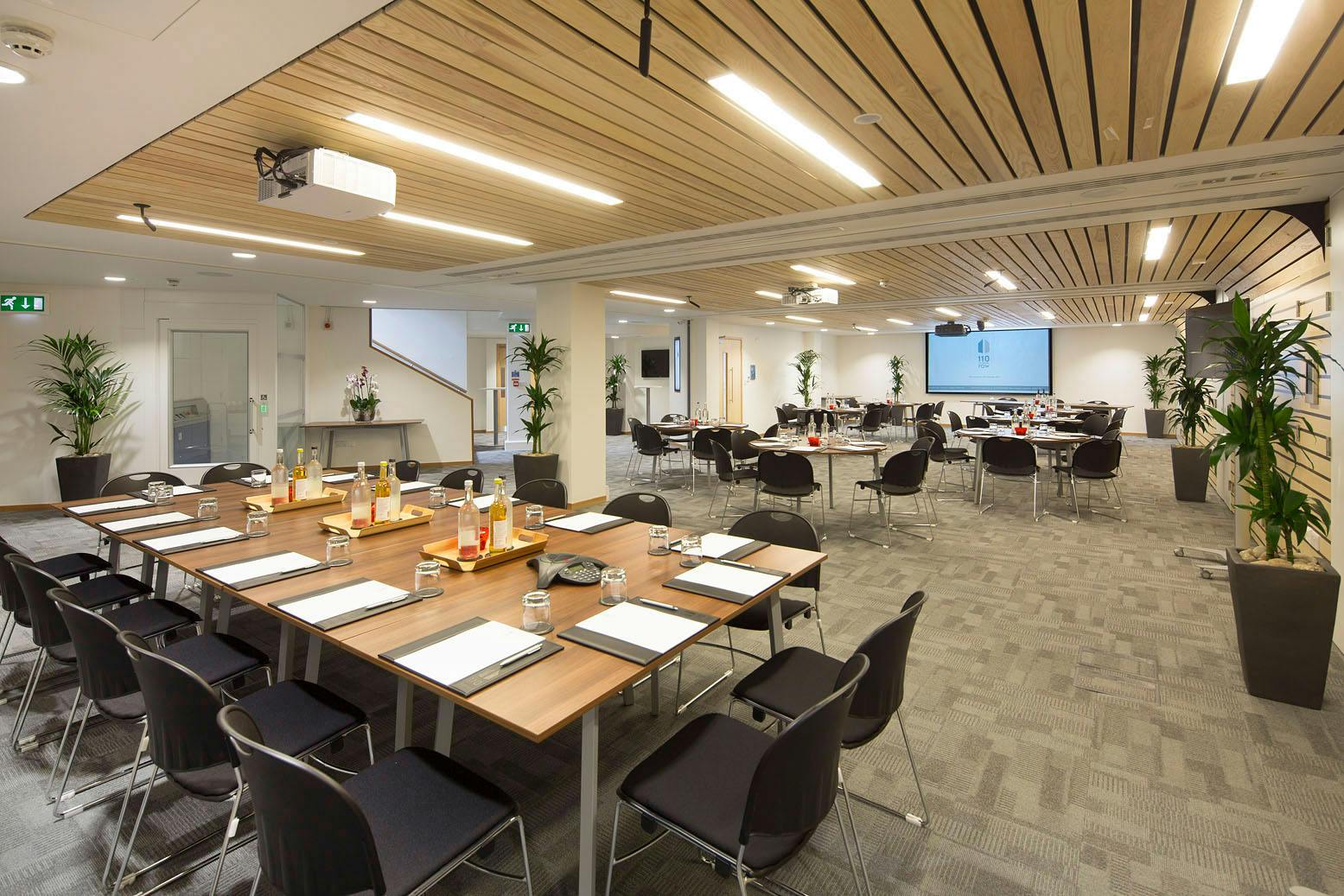 Nightingale Suite meeting space with large table, ideal for events and presentations.